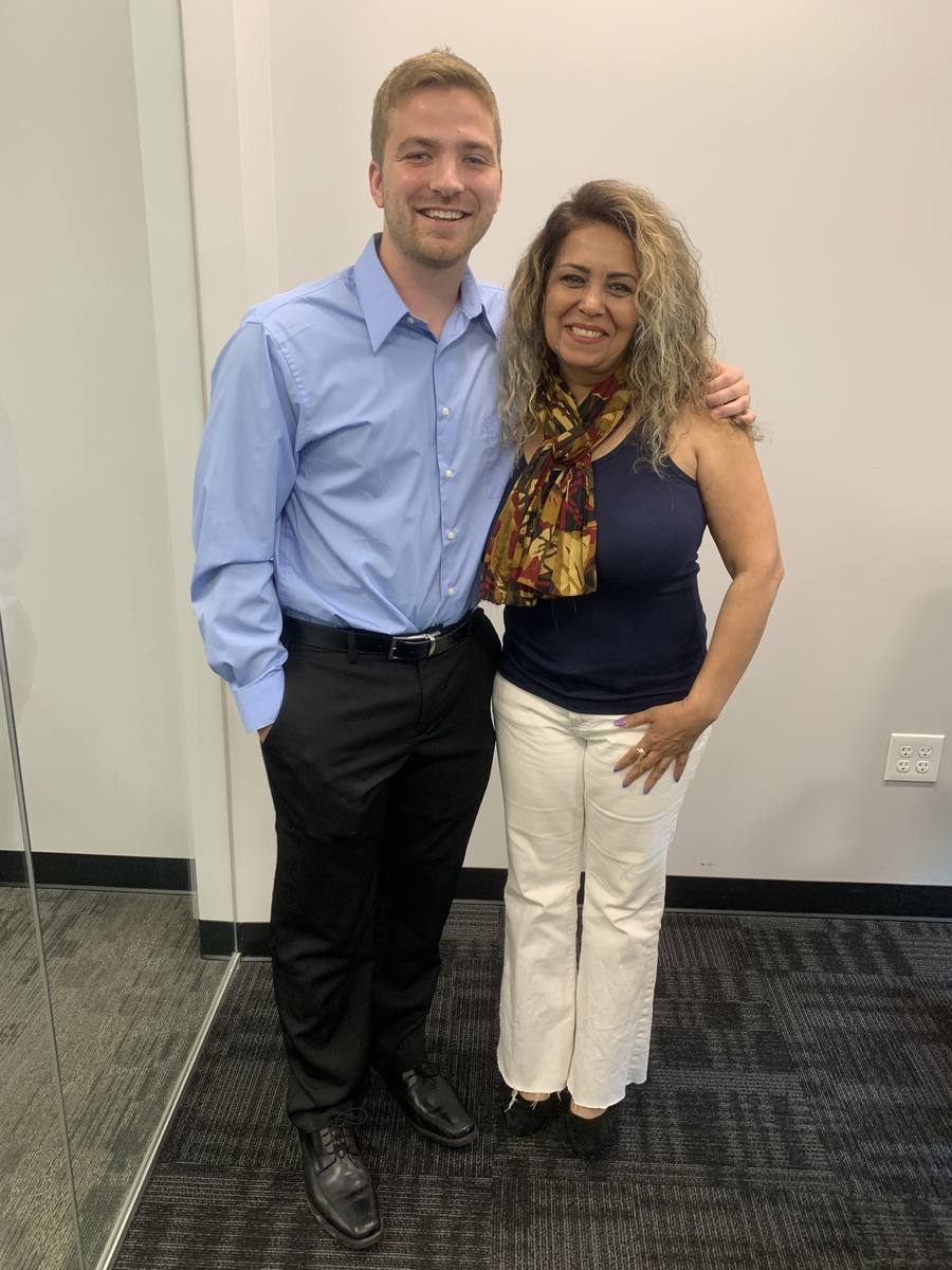 Connor Heriot with a client who sold in Alpharetta and bought in Sandy Springs