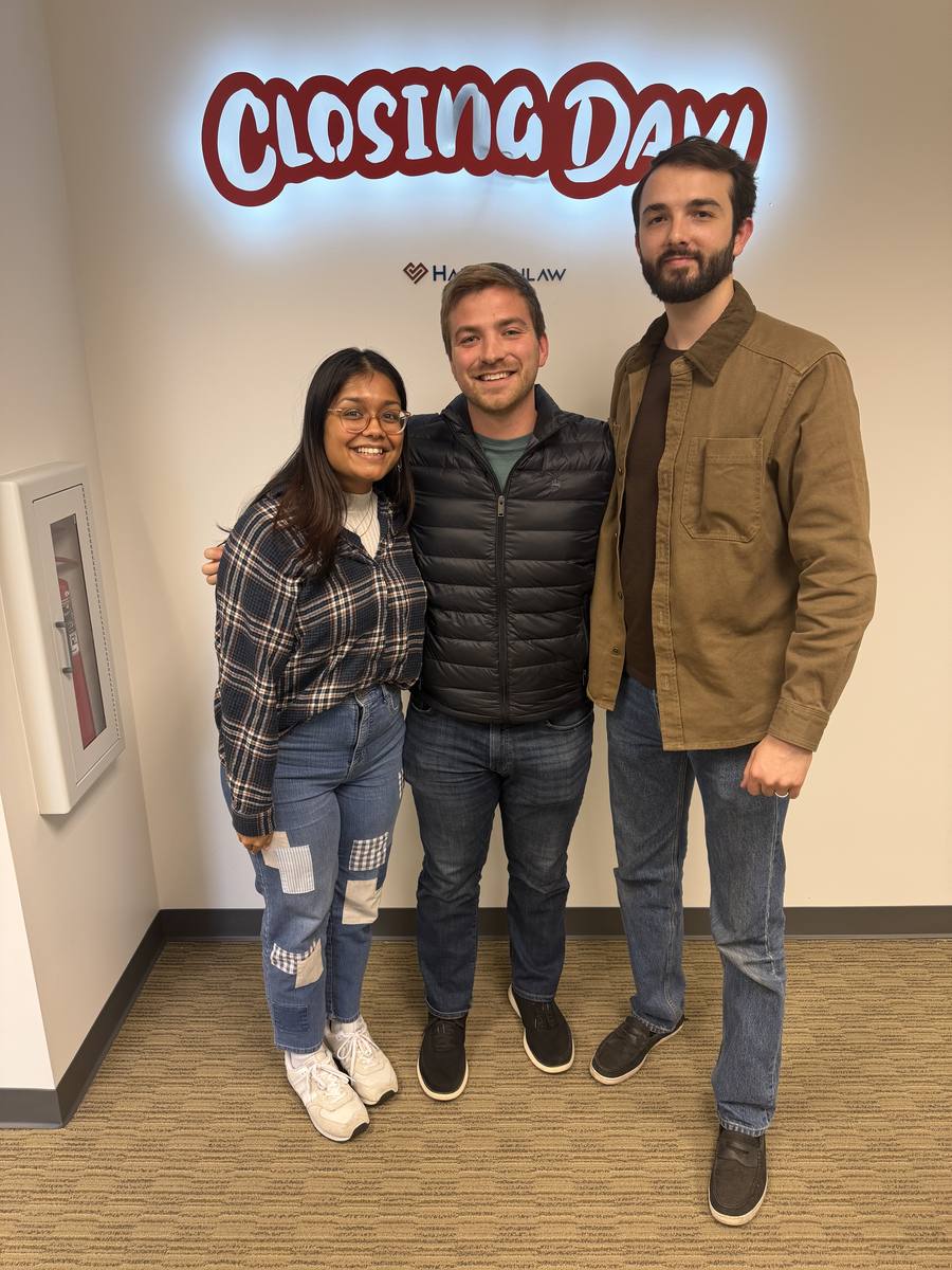 Connor Heriot with first-time homebuyer clients on closing day