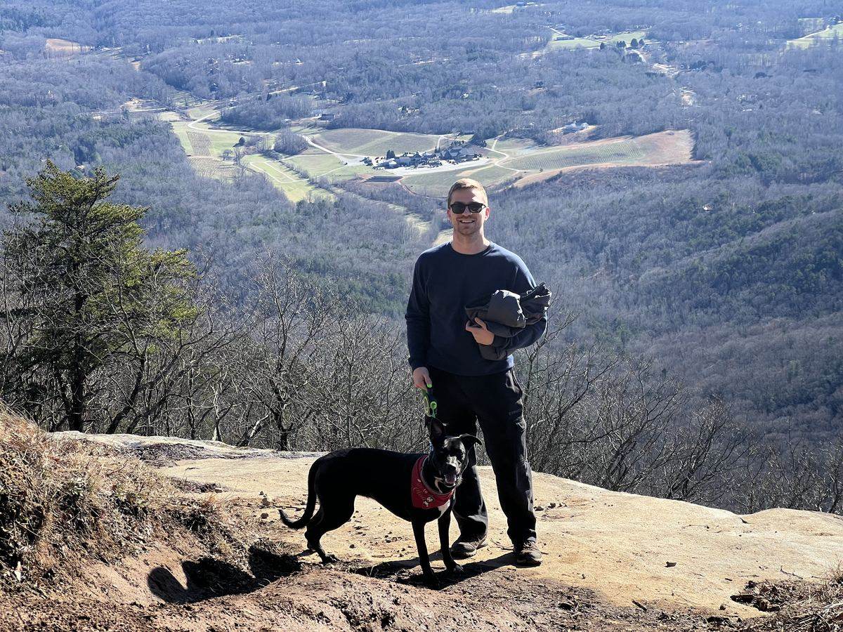 Connor Heriot with his dog Margot on a North Georgia overlook